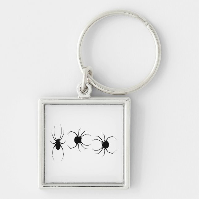 Black spiders on white key ring (Front)