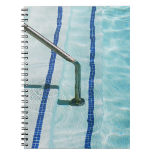 Black strap on blue swimming pool notebook