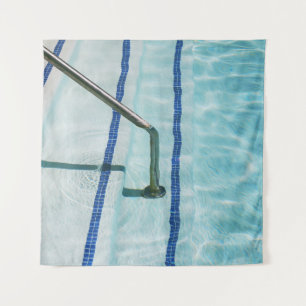 Black strap on blue swimming pool tapestry