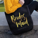 Black Stripes Faux Gold Brush Script Bridesmaid Tote Bag<br><div class="desc">Personalised Bridesmaid tote bag featuring the word "Bridesmaid" in faux gold trendy brush script against a black stripes background that's perfect for your bridesmaid to carry her items. Check out the matching makeup bag here https://www.zazzle.com/black_stripes_faux_gold_brush_script_bridesmaid_cosmetic_bag-223876160979955152 Personalise it by replacing the placeholder text. For more options such as to change the...</div>