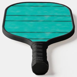 Black stripes on teal pickleball paddle