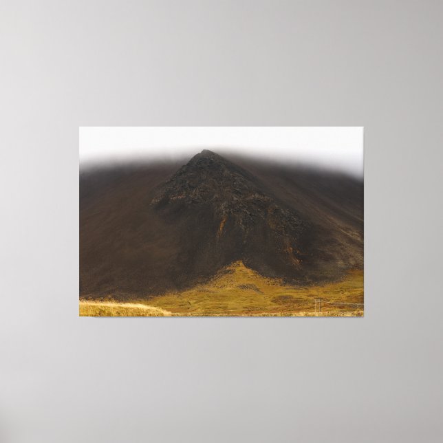 Black volcanic mountain and low clouds canvas art (Front)
