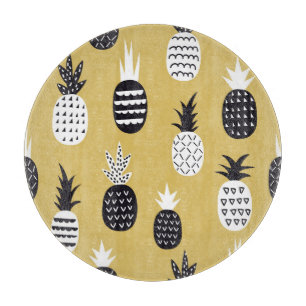 Black, white pineapples, yellow background cutting board