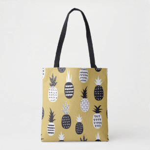 Black, white pineapples, yellow background tote bag