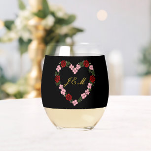 Black wine glass adorned with red and pink roses