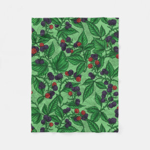 Blackberries on green fleece blanket
