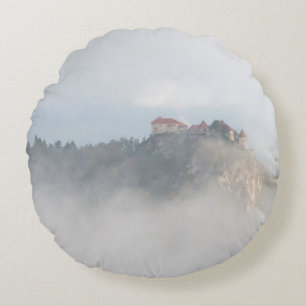 Bled castle surrounded by clouds round cushion