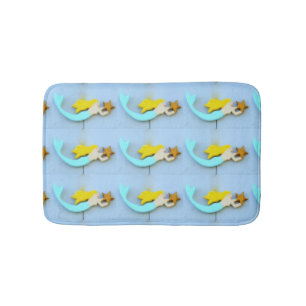 blonde-haired mermaids with stars bath mat