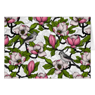 Blooming magnolia and titmouse bird