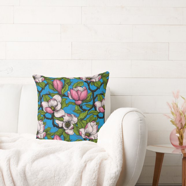 Blooming magnolia on blue cushion (Couch)