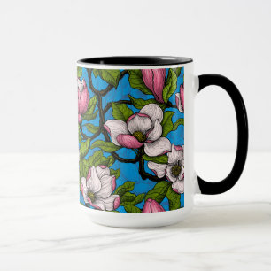 Blooming magnolia on blue mug