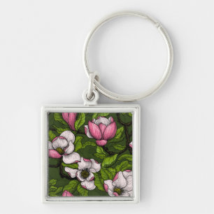 Blooming magnolia on dark green key ring