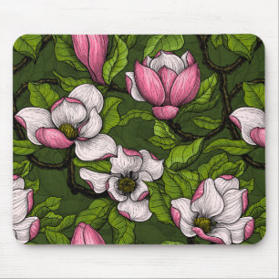 Blooming magnolia on dark green mouse mat