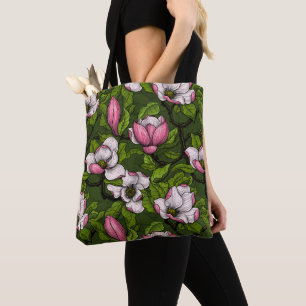 Blooming magnolia on dark green tote bag