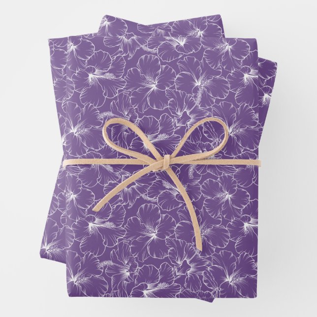 Blooming White Hibiscus Flowers on Purple Wrapping Paper Sheet (In situ)