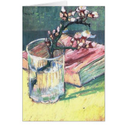 Blossoming Almond Branch in a glass and a book