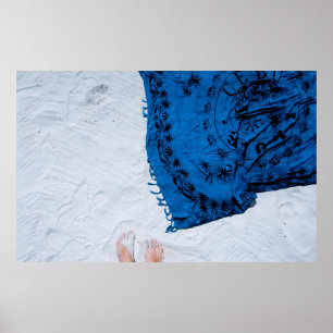 Blue and black floral scarf on white sand poster