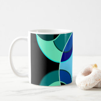Blue and green intersecting circles design coffee mug
