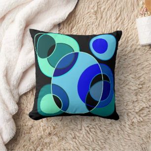 Blue and green intersecting circles design cushion