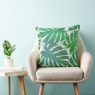 Blue and green palm tropical leaves cushion