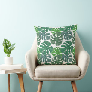 Blue and green palm tropical leaves cushion