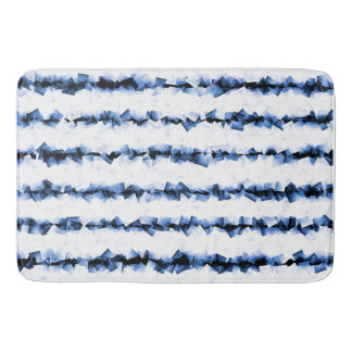 blue and grey crinkly textured lines on white bath mat