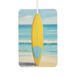 Blue and yellow surf board on the beach car air freshener