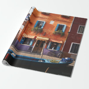 BLUE BOAT ON RIVER NEAR ORANGE BUILDING WRAPPING PAPER