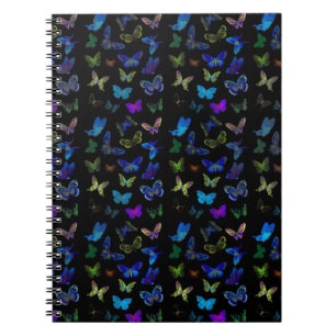 Blue butterflies on black notebook