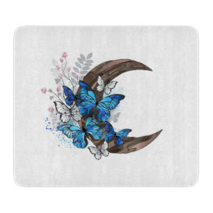 Blue butterflies on wooden crescent cutting board