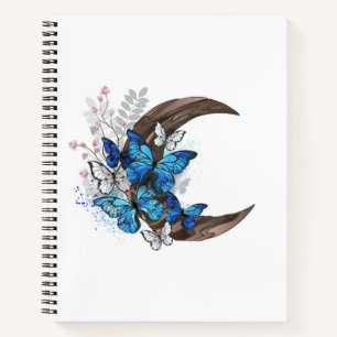 Blue butterflies on wooden crescent notebook