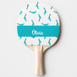 Blue dolphins on white ping pong paddle