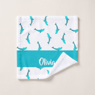 Blue dolphins on white wash cloth