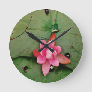 Blue Dragonflies on a pink lotus flower Round Clock