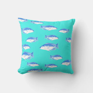 Blue fish on turquoise cushion