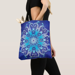 Blue floral mandala on grunge background. tote bag