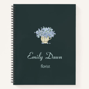 Blue flowers in vase grey notebook
