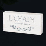 Blue Foliage | L'Chaim Typography with Family Name Wooden Box Sign<br><div class="desc">This stylish wooden box sign says "L'Chaim" in blue modern typography,  and is decorated with a branch of watercolor blue leaves. There is also room to add your family name to completely personalise. The perfect touch of decor for Hanukkah or any time of year!</div>