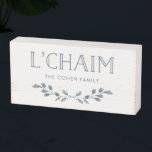 Blue Foliage | L'Chaim Typography with Family Name Wooden Box Sign<br><div class="desc">This stylish wooden box sign says "L'Chaim" in blue modern typography,  and is decorated with a branch of watercolor blue leaves. There is also room to add your family name to completely personalise. The perfect touch of decor for Hanukkah or any time of year!</div>