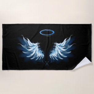 Blue Glowing Angel Wings on black background Beach Towel