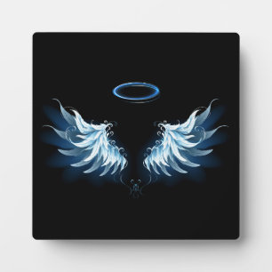 Blue Glowing Angel Wings on black background Plaque