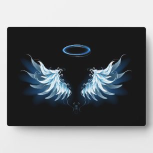 Blue Glowing Angel Wings on black background Plaque