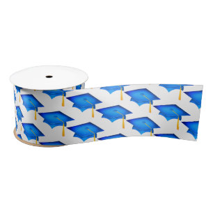Blue Graduation Caps On White Satin Ribbon