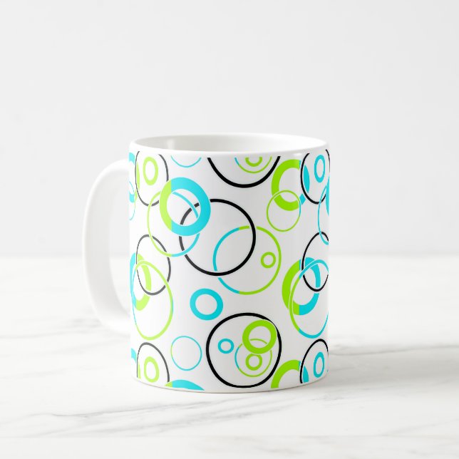 blue green and black rings and circles on white  coffee mug (Front Left)