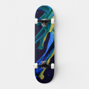 Blue, green and yellow paint on black 1 skateboard