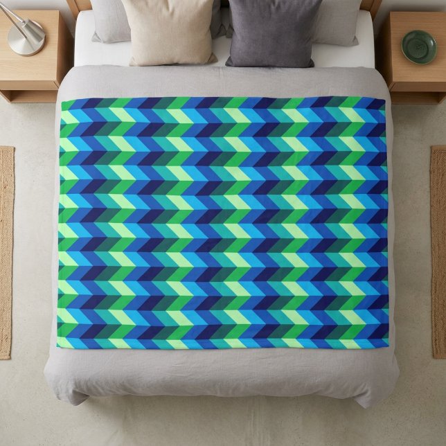 Blue Green Ombre Chevrons Medium Fleece Blanket (Blue Green Ombre Chevrons Medium Fleece Blanket on a bed.)