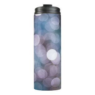 Blue grey bokeh, abstract background. thermal tumbler