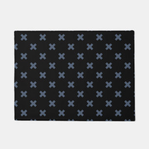Blue-grey cross stitches on black doormat