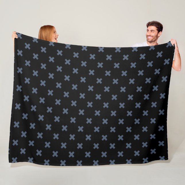 Blue-grey cross stitches on black fleece blanket (In Situ)