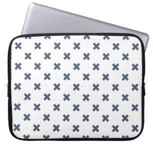 Blue-grey cross stitches on white laptop sleeve
